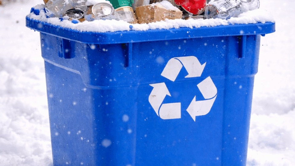 Recycling Bin full of items in the snow for recycled holiday crafts